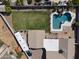 Aerial view of backyard featuring pool, patio, lush lawn, and RV parking at 232 W San Angelo St, Gilbert, AZ 85233