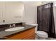 Bathroom featuring a vanity with granite countertop, mirror, and shower with dark curtain at 234 S Neely St, Gilbert, AZ 85233