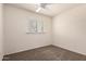 Bedroom featuring carpet flooring, a ceiling fan, and window that brings in light at 234 S Neely St, Gilbert, AZ 85233
