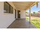 Covered patio with view of the backyard, featuring a door to the main house at 234 S Neely St, Gilbert, AZ 85233