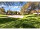 Outdoor basketball court surrounded by lush greenery offers a great recreational space at 2491 N 149Th Ln, Goodyear, AZ 85395