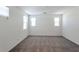 Spacious bedroom with neutral carpet, white walls, and natural light from the three windows at 2491 N 149Th Ln, Goodyear, AZ 85395