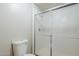 Full bathroom with toilet, and a shower enclosed with a sliding glass door at 29606 N Tatum Blvd # 265, Cave Creek, AZ 85331