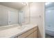 Bathroom featuring a light countertop and cabinetry with a large mirror at 29606 N Tatum Blvd # 265, Cave Creek, AZ 85331