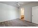 This bedroom boasts neutral walls and carpeting, and a ceiling fan at 29606 N Tatum Blvd # 265, Cave Creek, AZ 85331