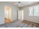 This bedroom boasts neutral walls and carpeting, and a ceiling fan at 29606 N Tatum Blvd # 265, Cave Creek, AZ 85331