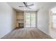 Bedroom with carpet, desk with shelving, and access to balcony with sliding glass door at 29606 N Tatum Blvd # 265, Cave Creek, AZ 85331