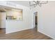 A modern dining room offers an opening into a well lit kitchen at 29606 N Tatum Blvd # 265, Cave Creek, AZ 85331