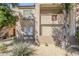 View of a condo with desert landscaping and mature shade trees at 29606 N Tatum Blvd # 265, Cave Creek, AZ 85331