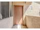 Front door of a unit with address number and sidelight window at 29606 N Tatum Blvd # 265, Cave Creek, AZ 85331