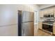 Modern kitchen with stainless steel appliances and sleek cabinets at 29606 N Tatum Blvd # 265, Cave Creek, AZ 85331