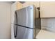 Kitchen featuring stainless steel refrigerator, light cabinets and light countertops at 29606 N Tatum Blvd # 265, Cave Creek, AZ 85331