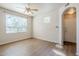 Bright, open living room with a ceiling fan and light-filled windows at 29606 N Tatum Blvd # 265, Cave Creek, AZ 85331