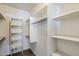 Spacious walk-in closet with built-in shelves and clothing racks, great for organization at 29606 N Tatum Blvd # 265, Cave Creek, AZ 85331