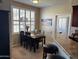 Dining area with natural light and shutters, next to breakfast bar at 29606 N Tatum Blvd # 276, Cave Creek, AZ 85331