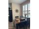 Elegant dining room with plantation shutters, sun decor, and a dark wood table at 29606 N Tatum Blvd # 276, Cave Creek, AZ 85331