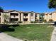 A spacious apartment complex with well-maintained landscaping and a lush green lawn at 29606 N Tatum Blvd # 276, Cave Creek, AZ 85331