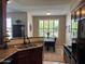 Modern kitchen featuring stainless steel sink and adjacent dining area with natural light at 29606 N Tatum Blvd # 276, Cave Creek, AZ 85331