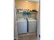 Laundry closet featuring a washer and dryer, and shelving at 29606 N Tatum Blvd # 276, Cave Creek, AZ 85331