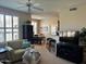 Open-concept living area with plantation shutters, breakfast bar, dining area, and adjacent kitchen at 29606 N Tatum Blvd # 276, Cave Creek, AZ 85331