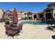 Community pool area featuring a clear swimming pool and ample seating for residents to relax and socialize at 29606 N Tatum Blvd # 276, Cave Creek, AZ 85331