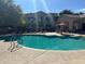 Large pool with surrounding lounge chairs and green landscaping for relaxation and leisure at 29606 N Tatum Blvd # 276, Cave Creek, AZ 85331