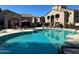 Sparkling pool with nearby seating and lush landscaping in a community setting at 29606 N Tatum Blvd # 276, Cave Creek, AZ 85331