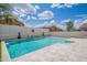 Beautiful backyard pool with lush landscaping and a soothing waterfall at 2969 E Trigger Way, Gilbert, AZ 85297