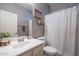 Neutral bathroom with vanity, toilet and shower/tub combo offers a calming and functional space at 2969 E Trigger Way, Gilbert, AZ 85297