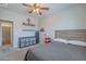 Neutral bedroom featuring gray walls, ceiling fan, carpet flooring, and view of ensuite bathroom at 2969 E Trigger Way, Gilbert, AZ 85297