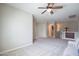 An open bonus room features a ceiling fan, and plenty of space for relaxing at 2969 E Trigger Way, Gilbert, AZ 85297