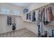 Spacious walk-in closet with shelves and bars for organizing clothing and accessories at 2969 E Trigger Way, Gilbert, AZ 85297