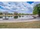 Scenic pond in a community park, surrounded by walking paths, offering residents a tranquil setting at 2969 E Trigger Way, Gilbert, AZ 85297
