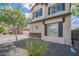 This is a view of the side of a home with low maintenance desert landscaping at 2969 E Trigger Way, Gilbert, AZ 85297