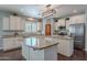 A gourmet kitchen featuring granite countertops and a center island at 2969 E Trigger Way, Gilbert, AZ 85297