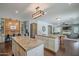 An open-concept kitchen and living room with a large kitchen island at 2969 E Trigger Way, Gilbert, AZ 85297