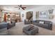 Spacious open-concept living room with kitchen views and lots of seating creates a comfortable atmosphere at 2969 E Trigger Way, Gilbert, AZ 85297