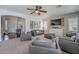 Bright living room featuring neutral walls, recessed lighting and plantation shutters for a crisp modern feel at 2969 E Trigger Way, Gilbert, AZ 85297