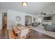 Bright eat-in kitchen featuring stainless steel appliances, large island, and dark hardwood floors at 2969 E Trigger Way, Gilbert, AZ 85297