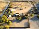 Aerial view of the property showcasing multiple structures, native landscaping, and clearly defined property boundaries at 29972 N Bryce Trl, San Tan Valley, AZ 85144