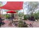 Outdoor living space featuring a fountain, patio, and lush desert landscaping at 29972 N Bryce Trl, San Tan Valley, AZ 85144