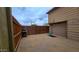 Fenced backyard featuring gravel ground cover and an outdoor grill at 29972 N Bryce Trl, San Tan Valley, AZ 85144