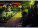 Night scene in backyard showcasing a dining set, decorative plants, and ambient lighting at 29972 N Bryce Trl, San Tan Valley, AZ 85144