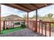 Inviting covered balcony with plants, artificial grass, and outdoor furniture at 29972 N Bryce Trl, San Tan Valley, AZ 85144
