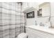 Well-lit bathroom featuring a white vanity, updated fixtures, and a shower-tub combo at 29972 N Bryce Trl, San Tan Valley, AZ 85144