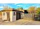 Detached garage with brown door and a separate entrance to a workshop at 29972 N Bryce Trl, San Tan Valley, AZ 85144