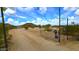 Large desert lot with a private gated entrance and surrounding desert landscape under a bright blue sky at 29972 N Bryce Trl, San Tan Valley, AZ 85144
