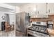 Well-equipped kitchen with stainless steel appliances and adjacent dining area for seamless entertaining at 29972 N Bryce Trl, San Tan Valley, AZ 85144