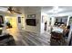 Open living space with sleek floors, TV, and views of adjacent rooms, creating an airy ambiance at 29972 N Bryce Trl, San Tan Valley, AZ 85144