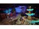 Inviting patio with a multi-tiered fountain and colorful landscape mural at 29972 N Bryce Trl, San Tan Valley, AZ 85144